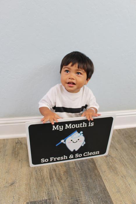 Young child swimming in pool l Kalaheo Dental Group