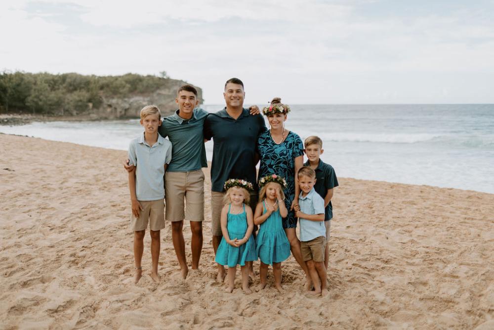 family of four smiling | family dentistry kauai