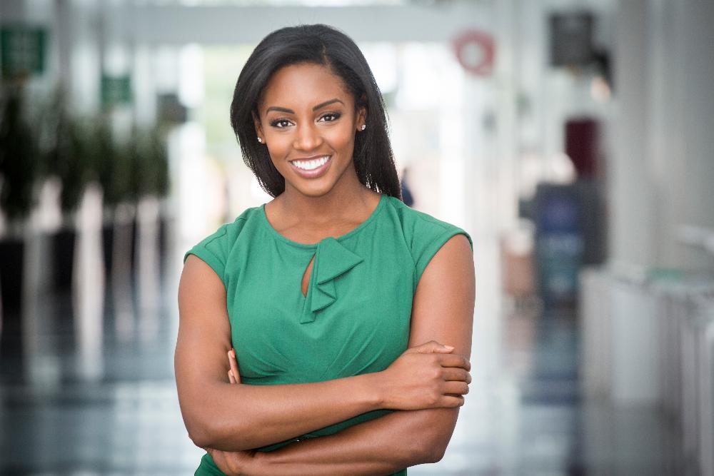 woman in green dress smiling | cosmetic dentist kaui