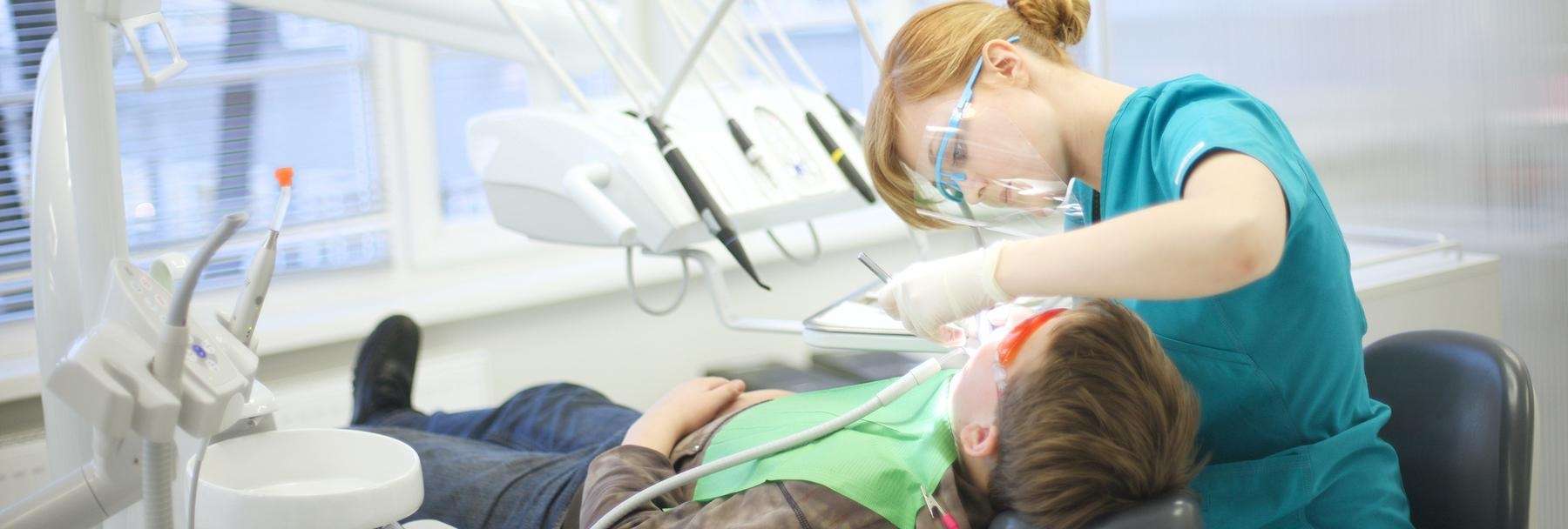 dentist working on patients teeth | dentist near me