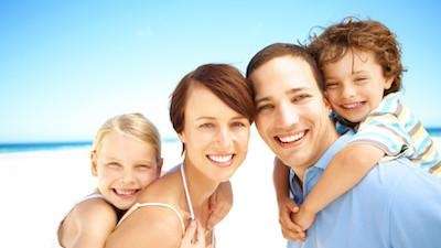 family of four on beach | kauai dentist