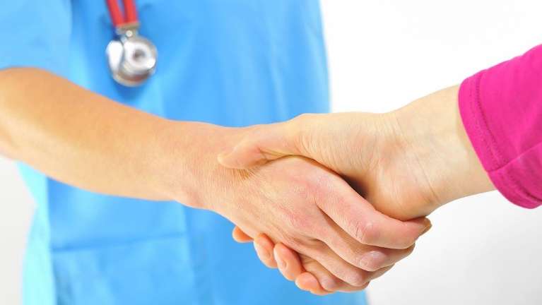 dentist shaking hands with patient | dentist near me