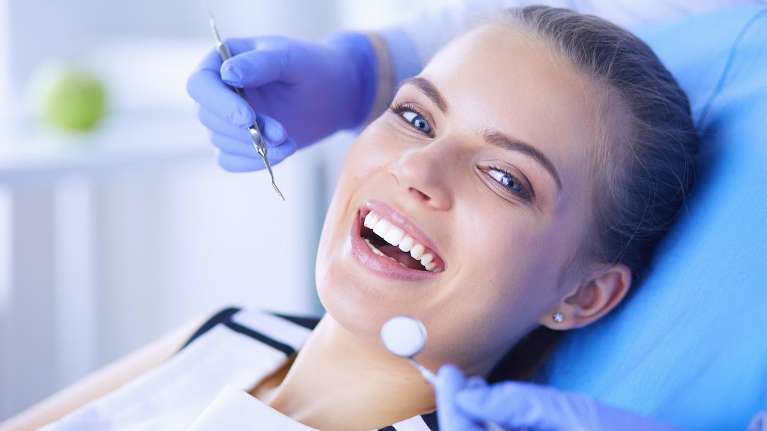 A woman getting a dental exam | dentist Kalaheo