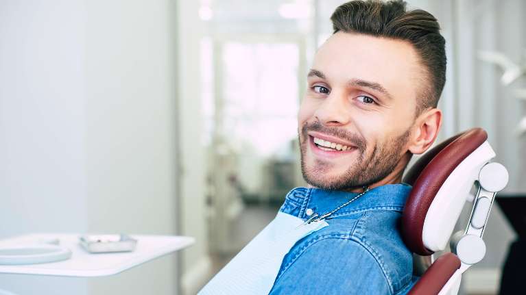 A man smiling in the dentist's office | dentist near Koloa